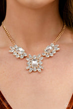 Load image into Gallery viewer, Paparazzi Exaggerated Elegance Gold Necklace (Fiercely 5th Avenue March 2023 Fashion Fix)
